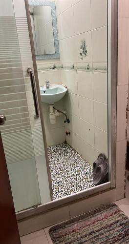 a bathroom with a sink and a toilet and a shower at New hoover hostel in Hong Kong