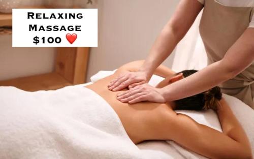 a woman getting a massage on her back in a bed at Pipa's Surf House Marbella Guanacaste in Cuajiniquil