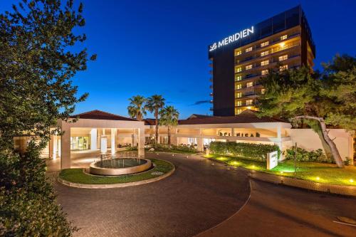 a view of a hotel with a building in the background at Le Meridien Lav Split in Podstrana