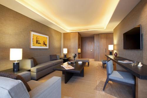 a living room with a couch and a table at JW Marriott Los Cabos Beach Resort & Spa in San José del Cabo