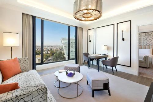 a living room with a couch and a table at The St. Regis Amman in Amman