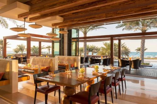 a dining room with a table and chairs at The St. Regis Saadiyat Island Resort, Abu Dhabi in Abu Dhabi