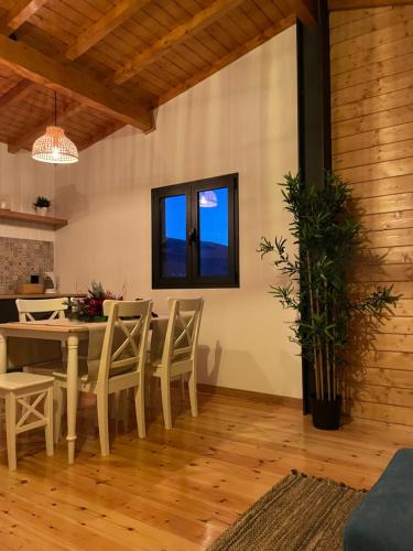 a dining room with a table and chairs at Perfect Mountain Lodge with Pool in Fafião