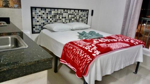 En eller flere senge i et værelse på Apartahotel El paraiso