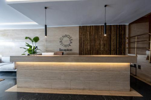 a lobby with a reception desk in a building at Bossa & Bed Hostel in Lisbon