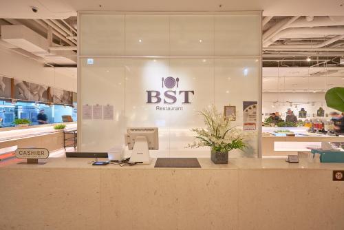a store front with a cash register in a store at Sotetsu Hotels The Splaisir Seoul Myeongdong in Seoul