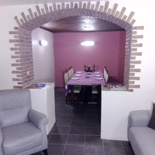 a dining room with a table and two chairs at Casa Amoreira - Quinta Amoreira in Faro