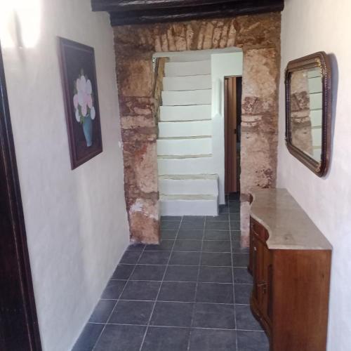 a hallway in a house with a tile floor at Casa Amoreira - Quinta Amoreira in Faro
