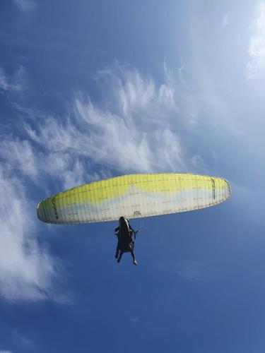 a person flying a surfboard in the sky at Puerto Alto Hostel in Santa Marta