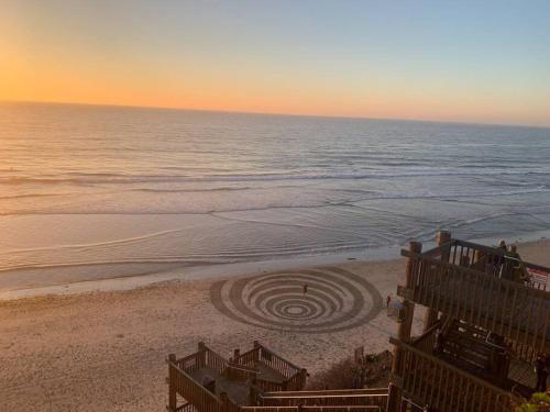 a spiralling labyrinth in the sand on a beach at Steps To The BEST Beach . Surf . Spa . Main Street in Encinitas
