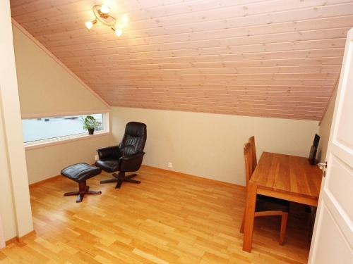 a room with a desk and two chairs and a table at Holiday Home Foreneset in Jelsa
