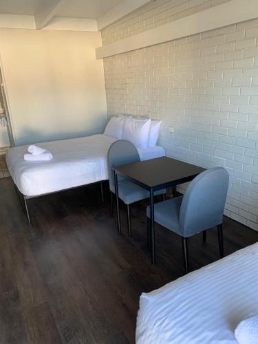 Ένα ή περισσότερα κρεβάτια σε δωμάτιο στο Wattle Motel