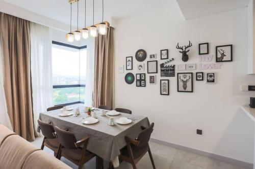 a dining room with a table and some chairs at Subang Jaya SS15 6min to Bandar Sunway By Nexx Field in Subang Jaya