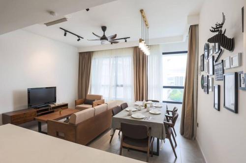 a living room with a couch and a dining room at Subang Jaya SS15 6min to Bandar Sunway By Nexx Field in Subang Jaya