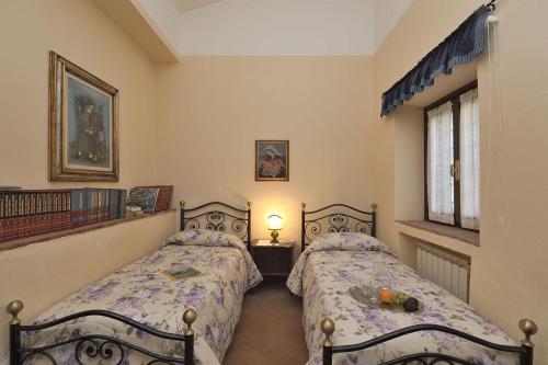 Ένα ή περισσότερα κρεβάτια σε δωμάτιο στο Luciana in Chianti