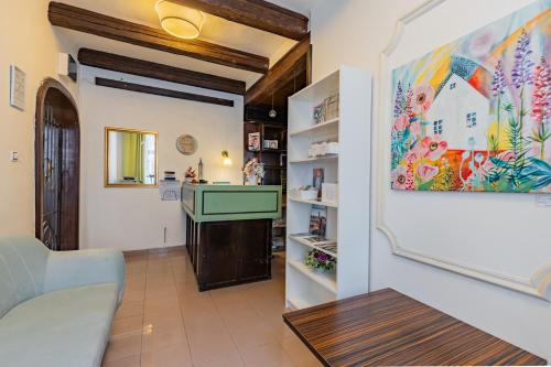 a living room with a couch and a table at Hotel Amadeus in České Budějovice