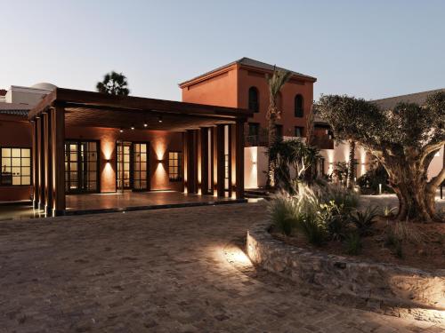 an exterior view of a building with a courtyard at The Chedi El Gouna in Hurghada