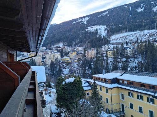 a view from the balcony of a building in the snow at The Lodge at Bad Gastein in Bad Gastein