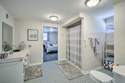 a bathroom with a sink and a toilet and a bedroom at Stunning Seneca Home with Lake Keowee Access! in Seneca