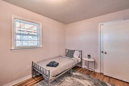 a small bedroom with a bed and a window at Stunning Seneca Home with Lake Keowee Access! in Seneca
