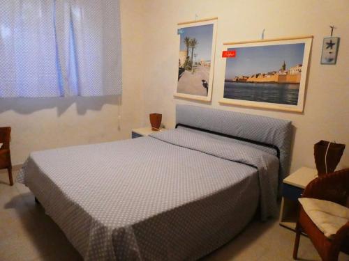 a bedroom with two beds in a room at Casa Lore al mare in Santa Lucia