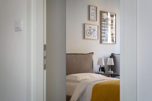 Postel nebo postele na pokoji v ubytování Everyday Apartments Corte Petroni