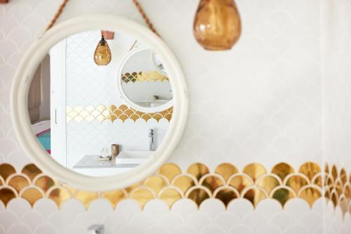a bathroom with a mirror and a sink at Sun Siyam Iru Veli - 24 Hours Premium All-Inclusive with Free Transfers in Dhaalu Atoll