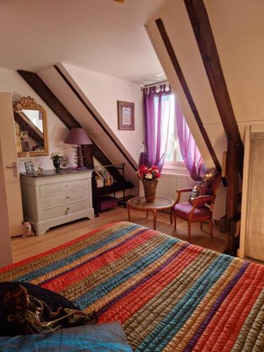 a bedroom with a bed and a dresser and window at Leira 