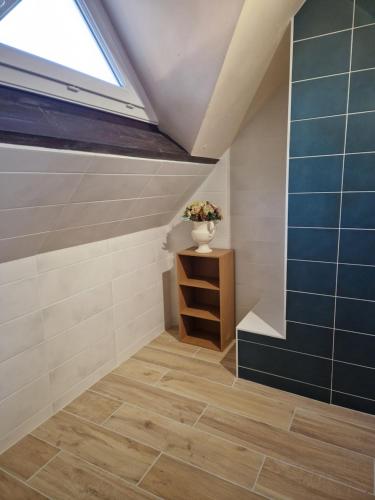 a attic room with a skylight and a stair case at Leira 