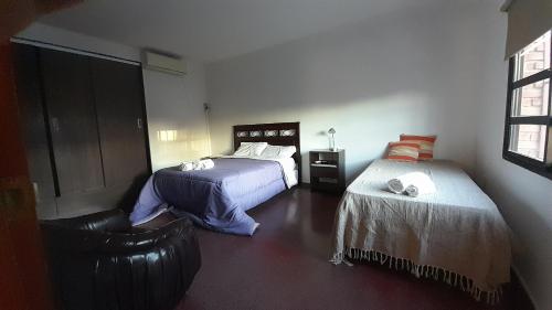 Postel nebo postele na pokoji v ubytování DEPARTAMENTO AMPLIO EN SAN LUIS