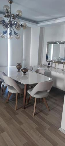 a dining room with a white table and chairs at Private Room in Istanbul #35 in Istanbul