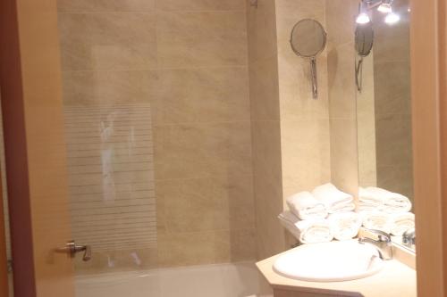 a bathroom with a sink and a toilet and a shower at Hotel Balcón de San Bartolo in Barreiros