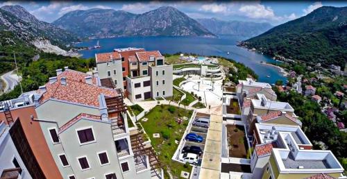 arial view of a city and a body of water at Lavender Bay Apartment in Donji Morinj