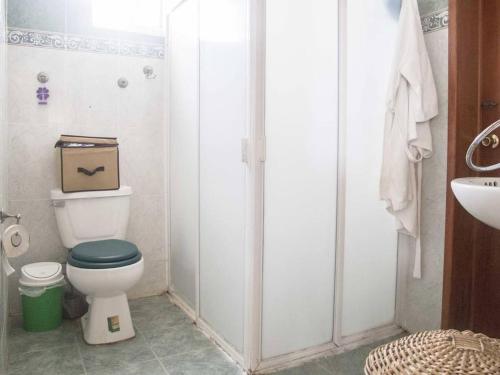 a bathroom with a toilet with a box on it at Holiday home for 6 people in Cancún