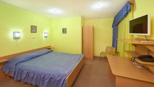 Ein Bett oder Betten in einem Zimmer der Unterkunft Gornitsa Hotel