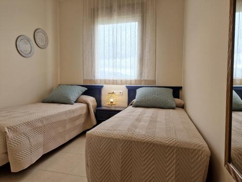 Кровать или кровати в номере EDIFICIO LARIMAR