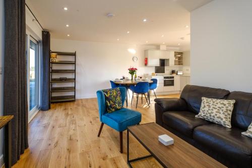 a living room with a couch and a table at Three Tuns - Garden Suite 2 in Wickham Market