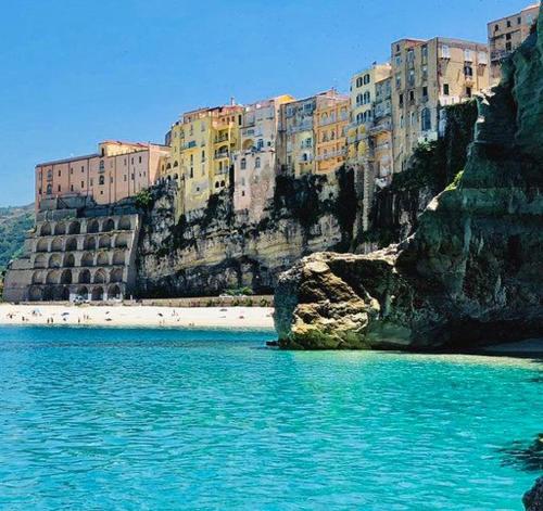 a group of buildings on the side of a mountain at Le Due Sicilie in Tropea