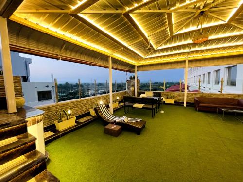a living room with a couch and chairs on a building at Ramada Neemrana in Neemrana