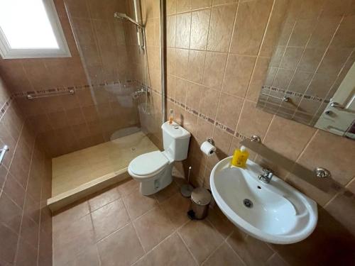 a bathroom with a toilet and a sink at Garden Apartment with directly entry to the Bay -Block N Ap 01 - Tatlisu - North Cyprus in Küçükerenköy