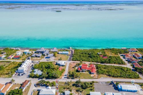an aerial view of a resort next to the ocean at Bright and Roomie Bottle Creek Apartments in NCA