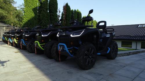 a row of atvs parked in a row at Casa YDA in Horezu