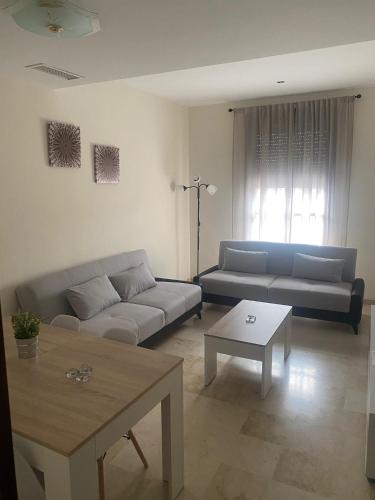 A seating area at APARTAMENTO TURÍSTICO VEGA HOUSE