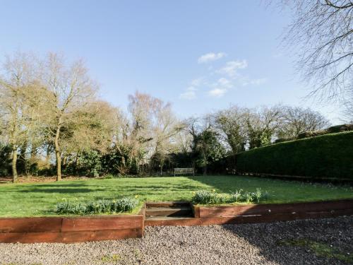 a garden with a path in the middle of a field at The Orangery in Worcester