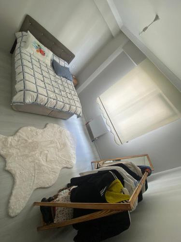 een kleine zolderkamer met een bed en een lamp bij Private Room in Istanbul #38 in Istanbul
