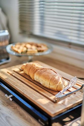 a loaf of bread sitting on a cutting board at Ionian Aura in Tsilivi
