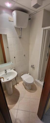 a bathroom with a sink and a toilet at La Casa di Nazareth in Rome