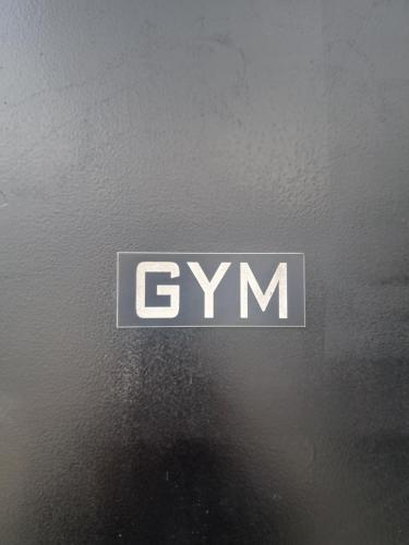 a gray and white logo on the side of a car at Calma Suites Tejeda in Tejeda