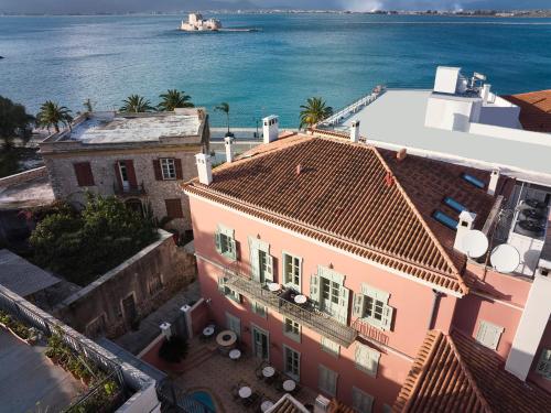 an aerial view of buildings and the ocean at Hotel Ippoliti in Nafplio