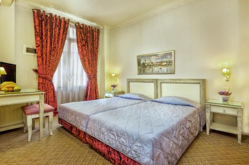 A bed or beds in a room at Egnatia Hotel